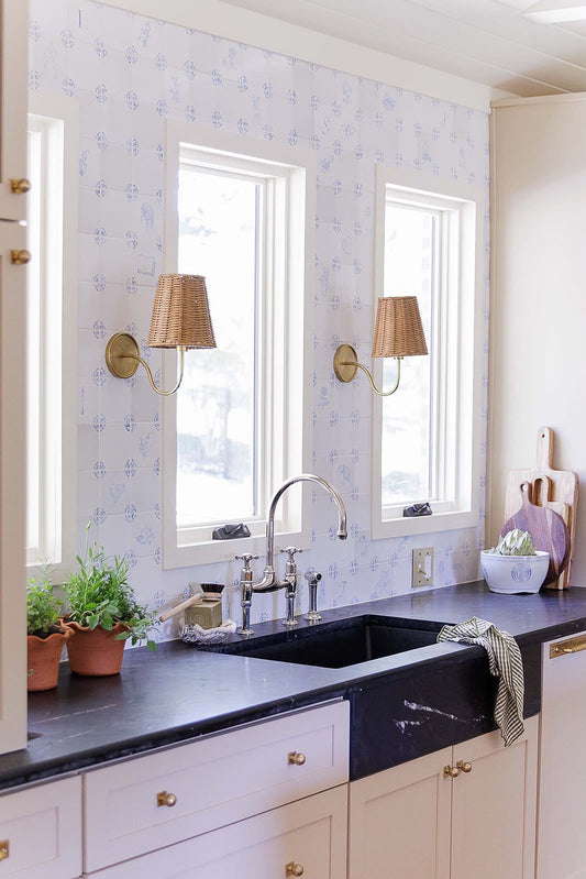 Full-height hand-painted Delft tile backsplash running bench to ceiling around two windows in a Franklin Tennessee kitchen by Triple House Design