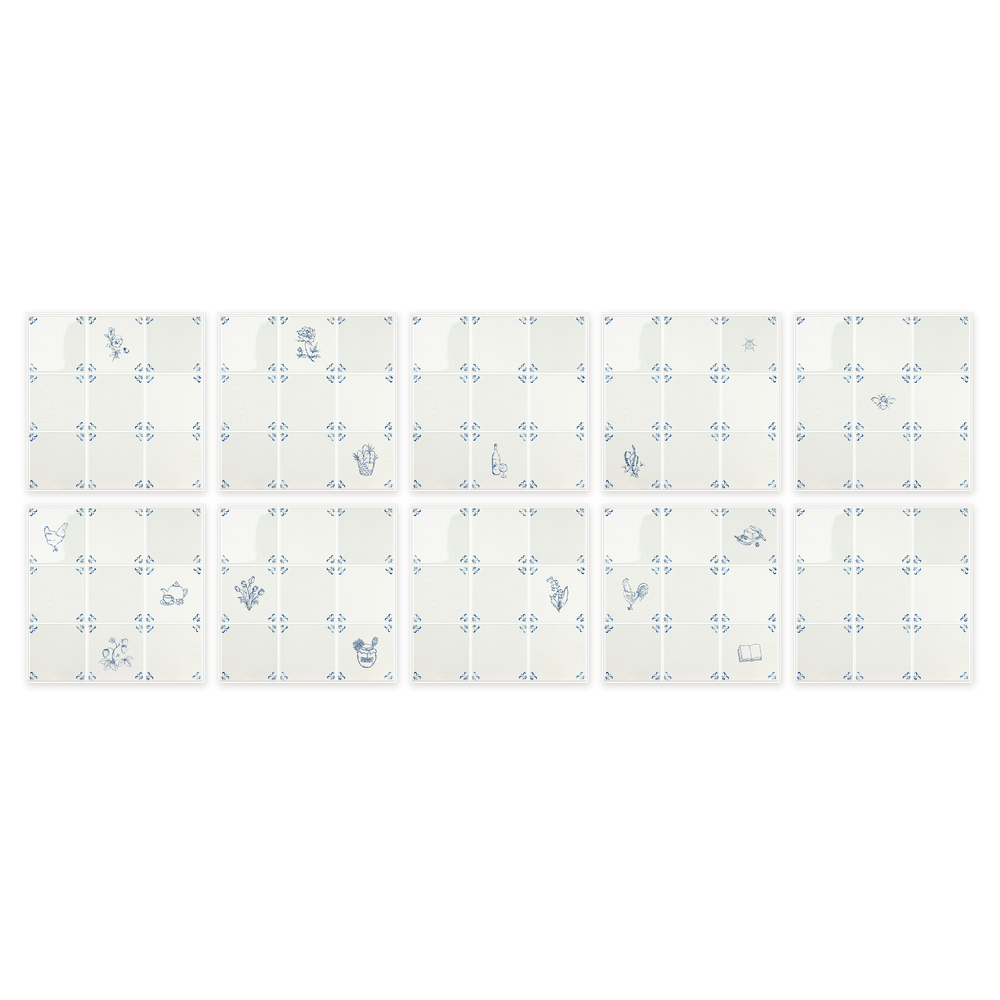 All ten peel and stick Delft tile sheets from the Akka Home Motif Box laid out in a grid — sixteen blue motifs across nine sheets, one plain