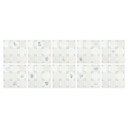 All ten peel and stick Delft tile sheets from the Akka Home Motif Box laid out in a grid — sixteen blue motifs across nine sheets, one plain