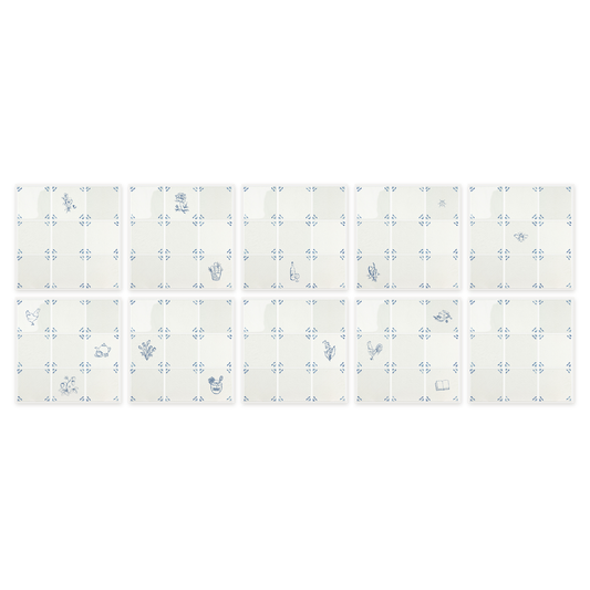 All ten peel and stick Delft tile sheets from the Akka Home Motif Box laid out in a grid — sixteen blue motifs across nine sheets, one plain